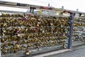 Traditional Ã¢â¬ÅLove locksÃ¢â¬Â attached to a pedestrian bridge across Seine river, Paris